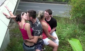 Cum on a fat wife with large mounds in bizarre public foursome sex by a highway